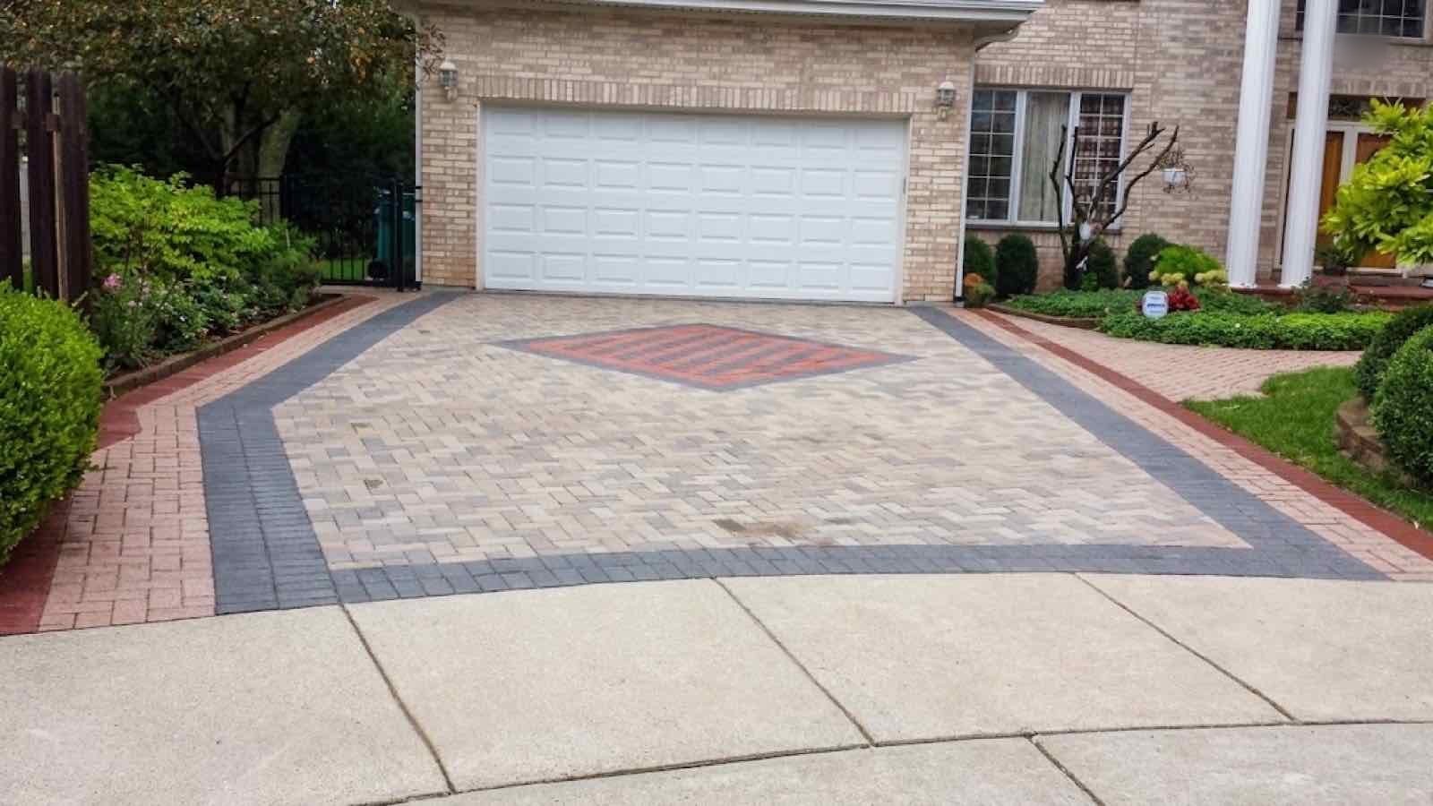 Paver driveway apron with a decorative diamond inlay pattern